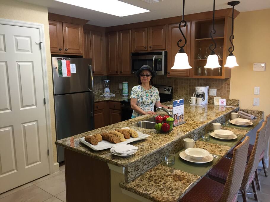 Room A Full kitchen with granite counters and stainless appliances. W/D behind door.