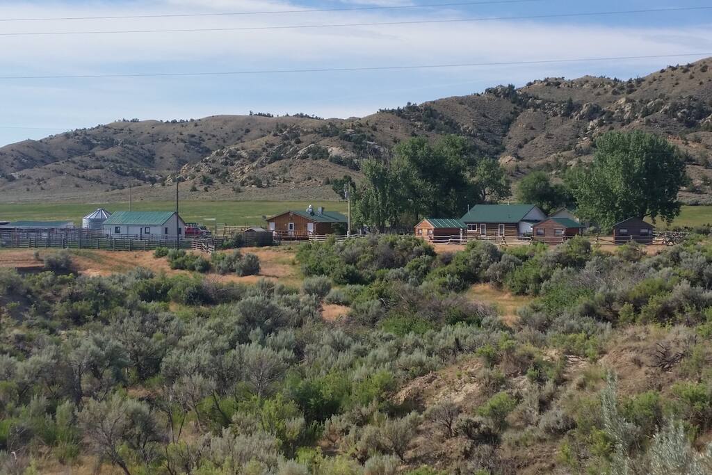 Homesteader cabin and cook house located on our home, Grass Creek Ranch! You will be 40 miles from Thermopolis, 30 miles from Meeteestee and 1 hour from Cody, Wyoming. Grass Creek is a remote area so the only cell phone signal or WiFi will be in the cook house!