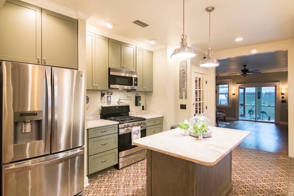 Kitchen with a microwave and refrigerator for use