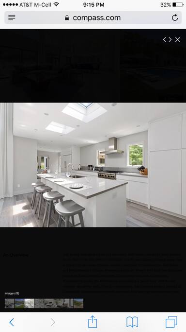 Fully-stocked cooks kitchen flooded with natural light.