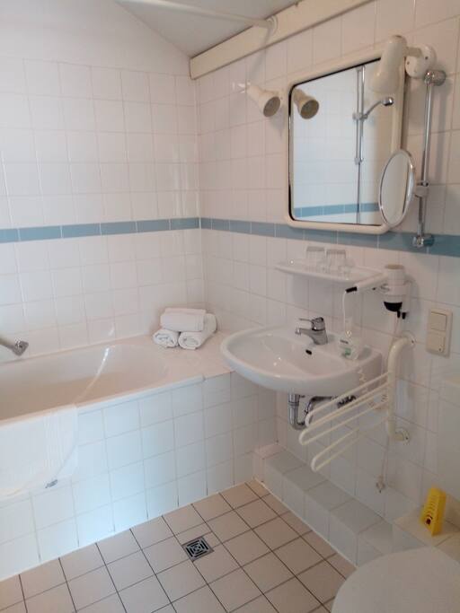 Bathroom/WC with hair dryer and cosmetic mirror.