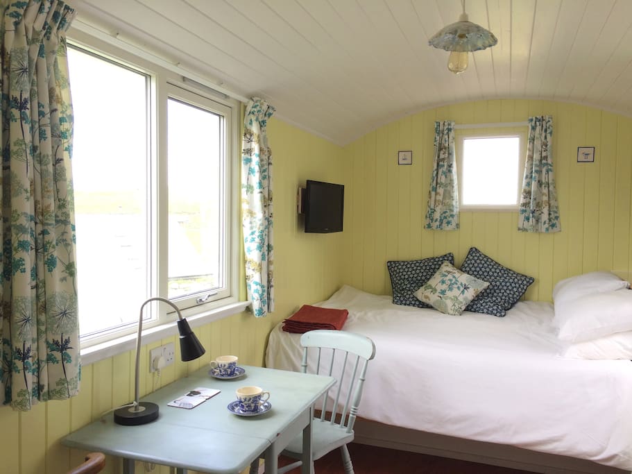 Tea for 2? The hut has 1 double bed, a small dining area, TV/DVD player, DVD's, novels and local info books.