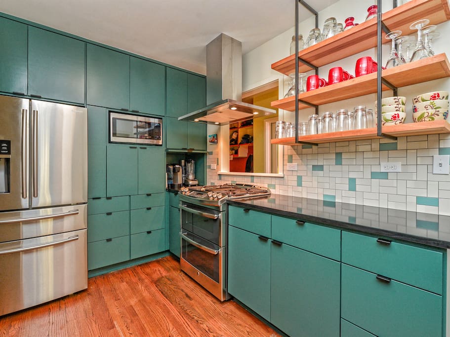 Newly remodeled kitchen with gas stove, double oven, dishwasher, Keurig coffee maker, food processor, and blender. Fully stocked with pots, pans, silverware, cooking oil, etc.