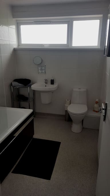 Clean and spacious modern bathroom with constant hot water available through combi boiler