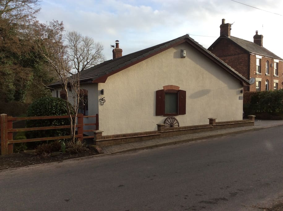 View of Smithy Cottage from Norley Lane. Please note the room is at the back of the house
