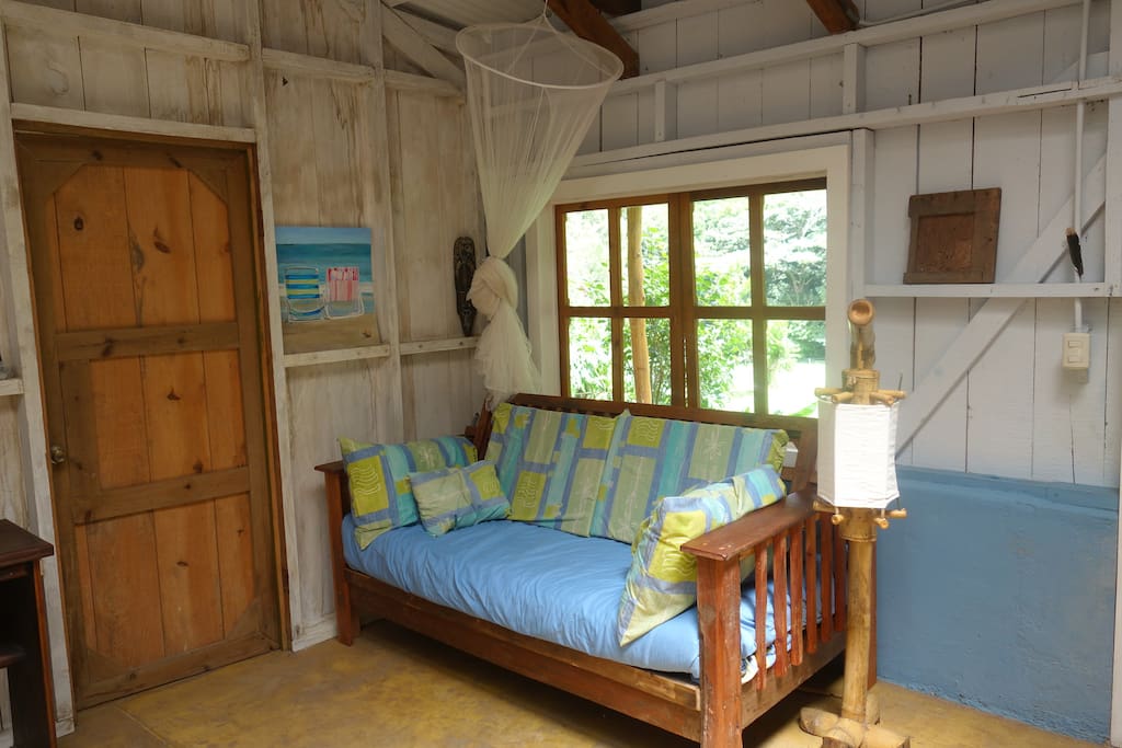 Hand crafted daybed couch turns into twin bed.