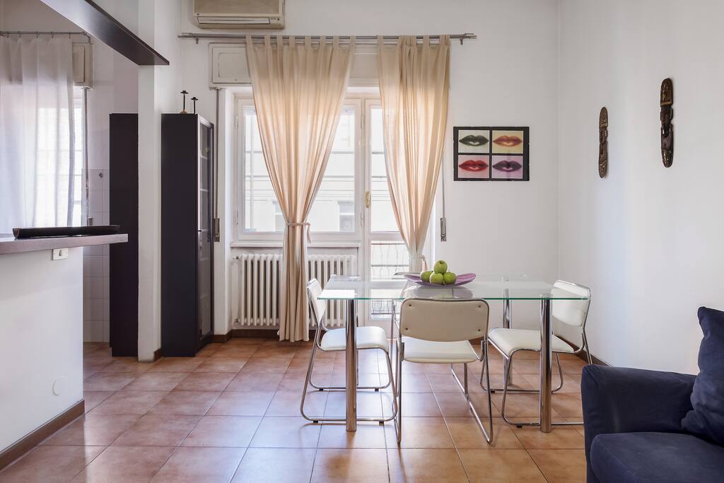 The Living room with the dining table & the large window