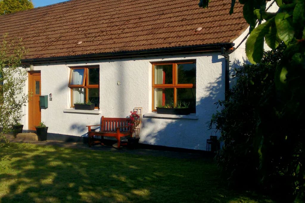 Front of the cottage in the evening sunlight