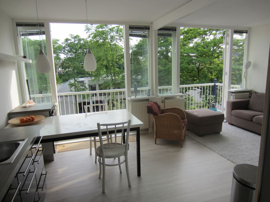 Sunny living with 2 double doors to balcony