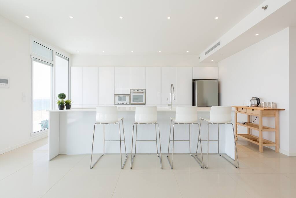Sleek, modern kitchen with breakfast bar