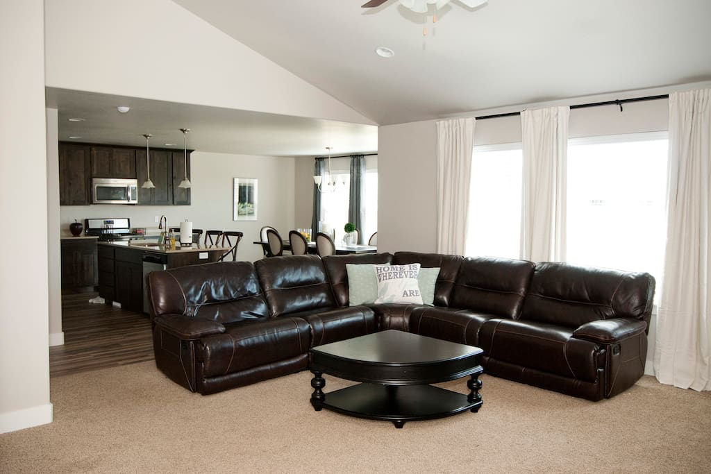 Oversized sectional couch faces gigantic 70" wall-mounted TV