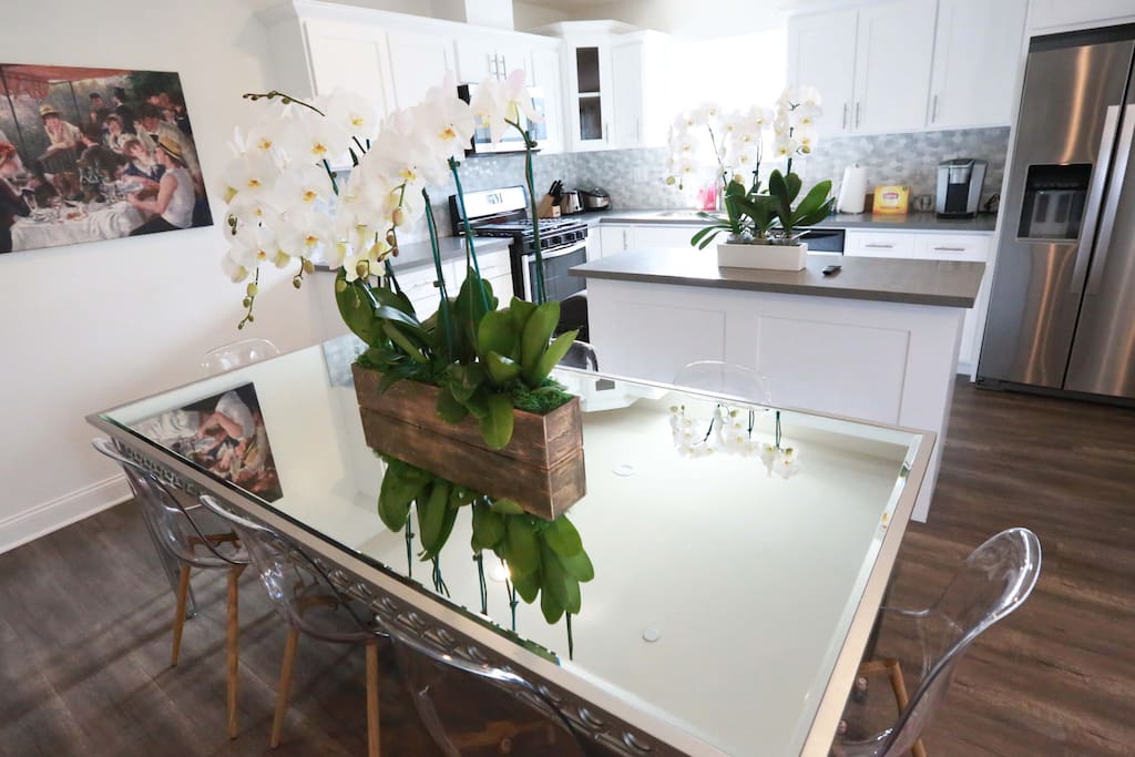 Gorgeous glass dining table with seating for 8 guests