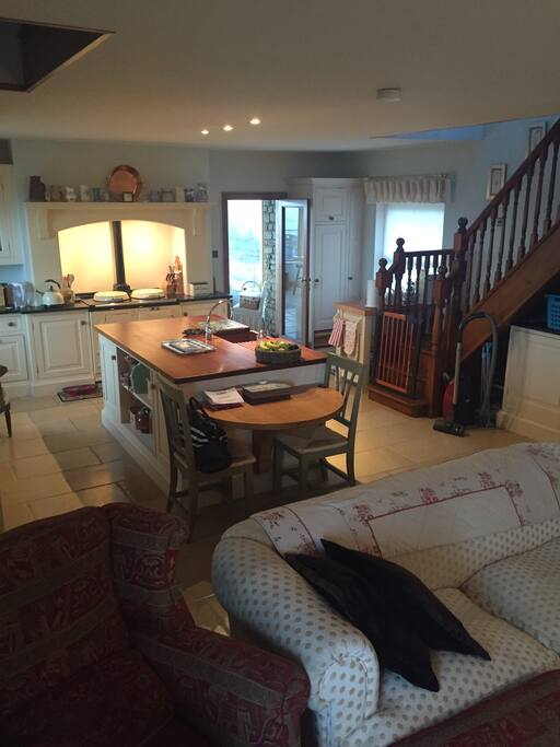 Kitchen /sitting room with stairs going to first bedroom