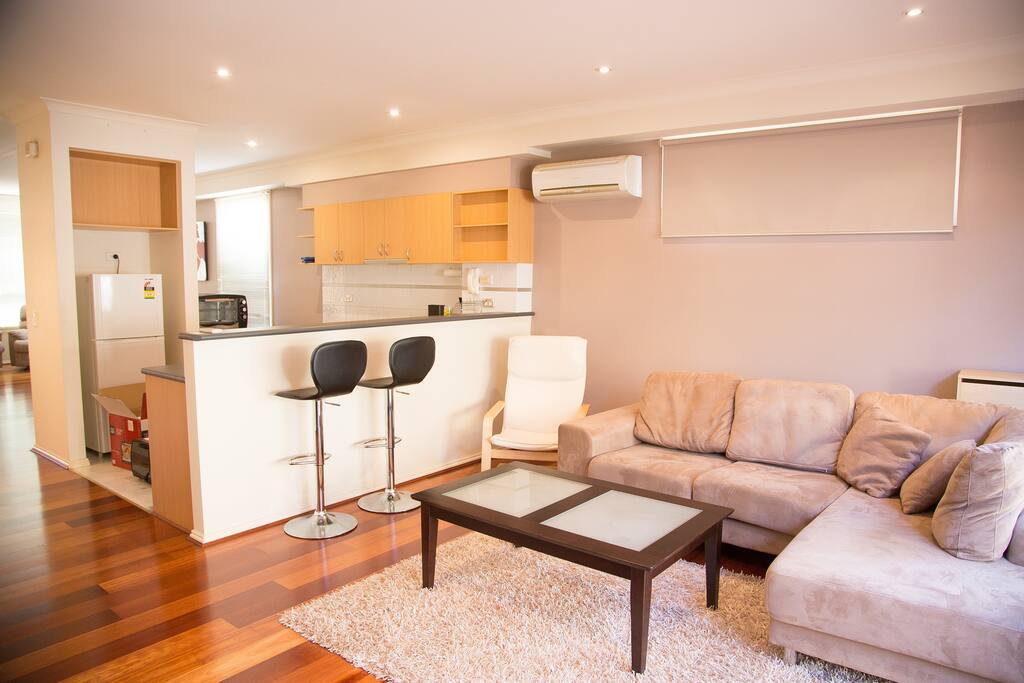 A very comfy living area with a 3-seat sofa with chaise.