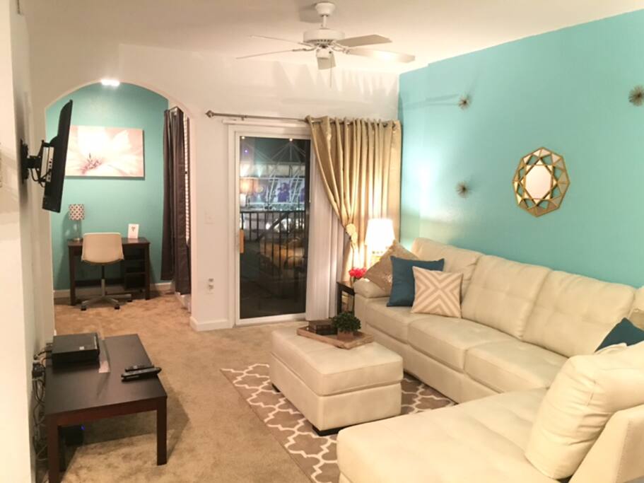 Living room with view of stadium from balcony