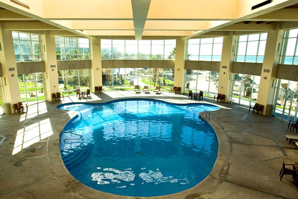 The indoor pool surrounded by windows is the perfect spot for dip no matter the weather.