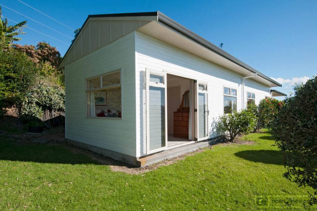 Main 3 bedroom house featuring 1 king bed, 2 bedrooms with 2 single beds each