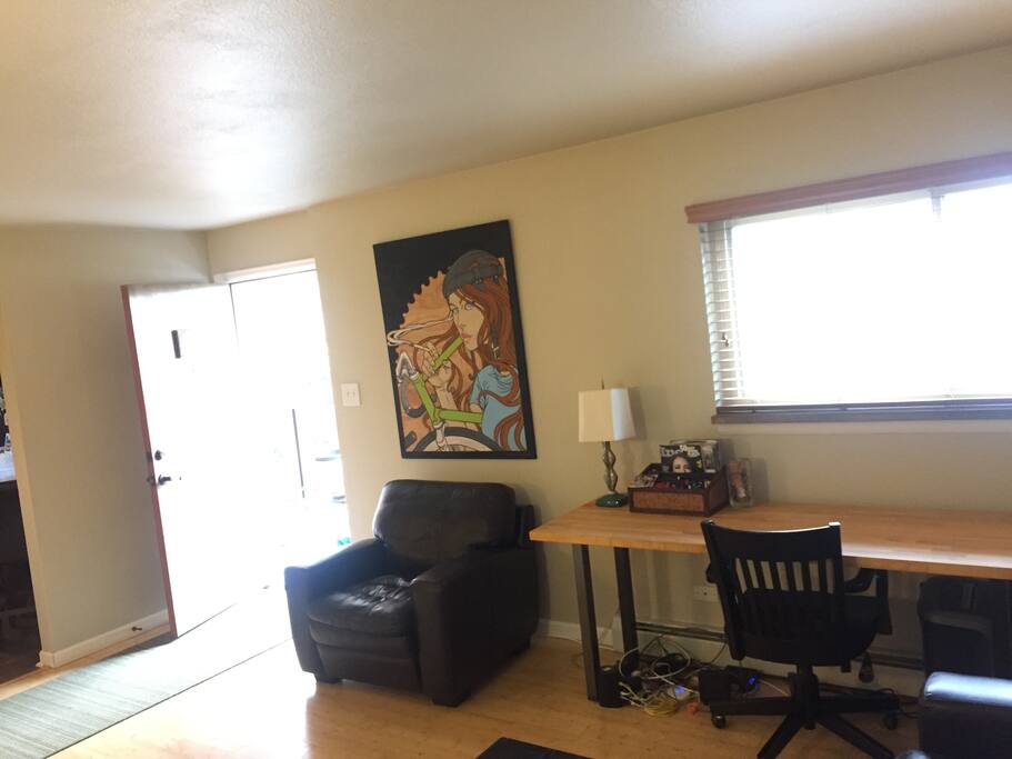 Butcher block work desk and south-facing unit with lots of sunlight