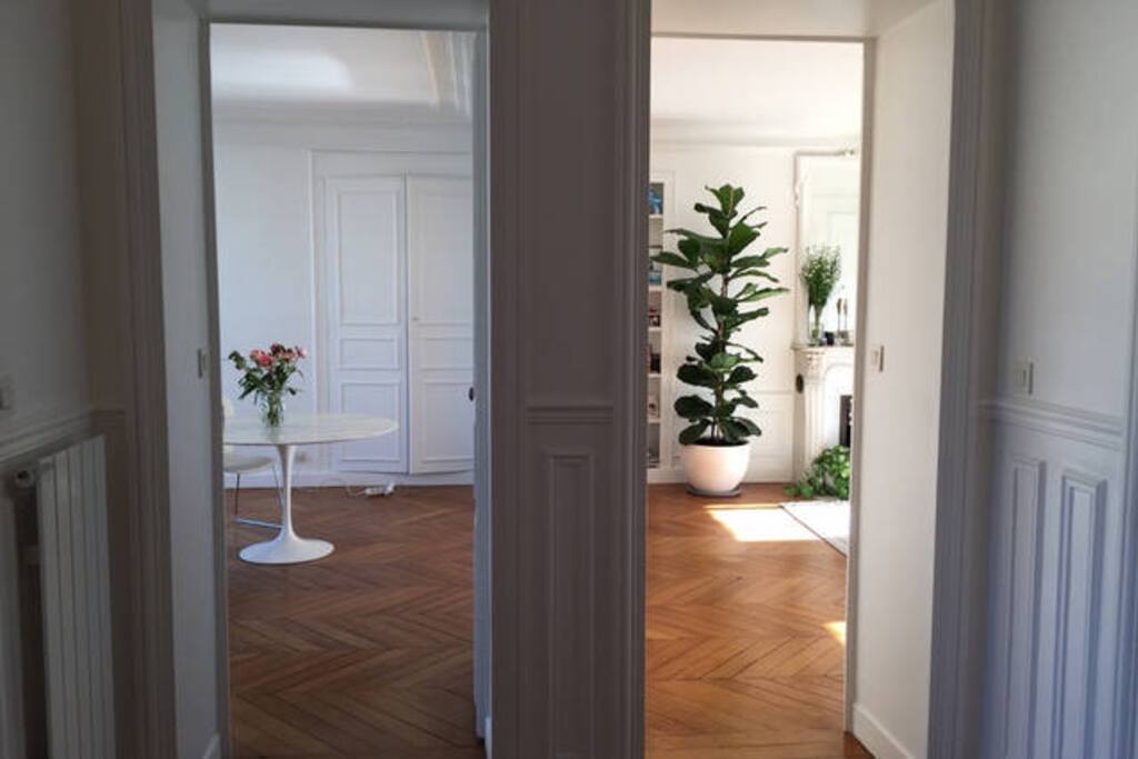 Photo taken from the entrance. Small entrance which leads into dining and living room.