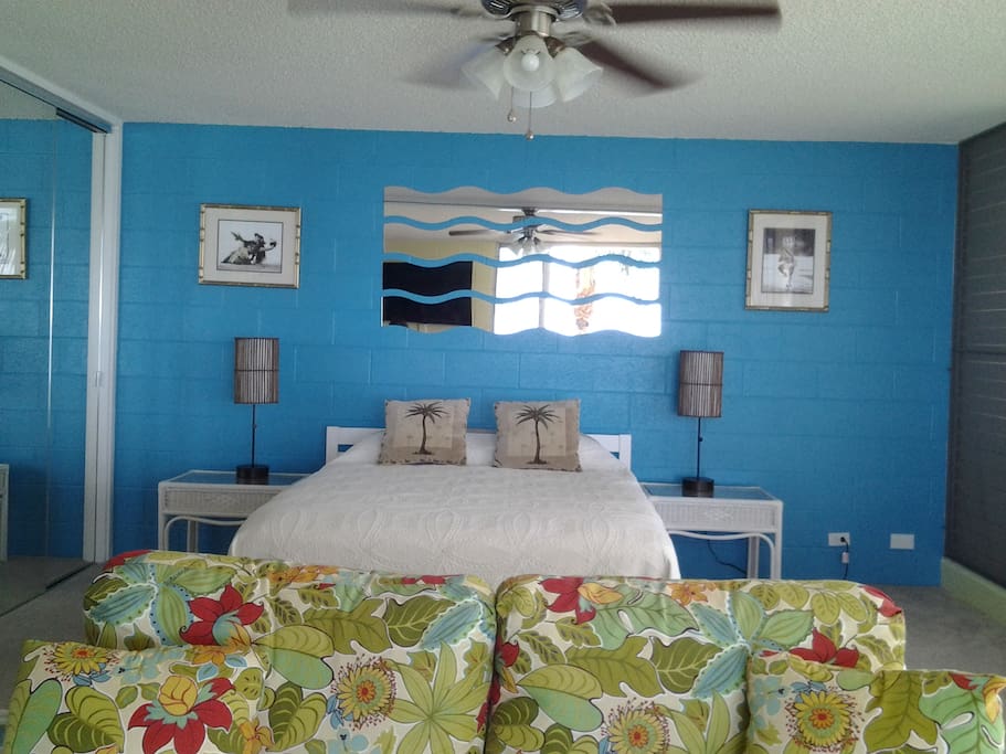 Open 1-BR layout. Removed wall opens the bedroom to ocean views. Memory foam mattress.