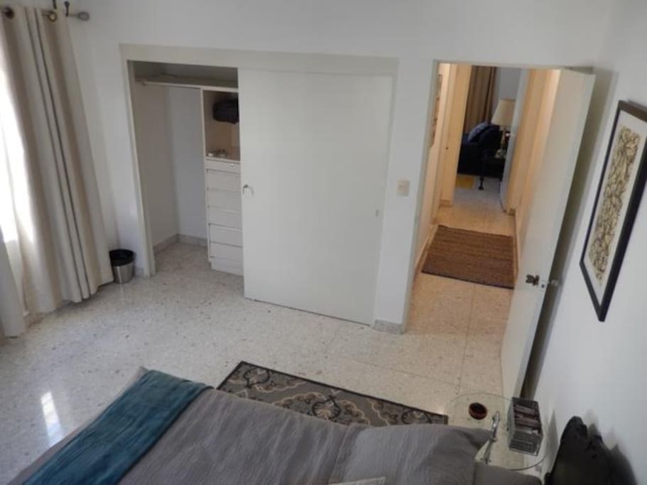 and a large closet. Across the hallway is the other room and one of the bathrooms.