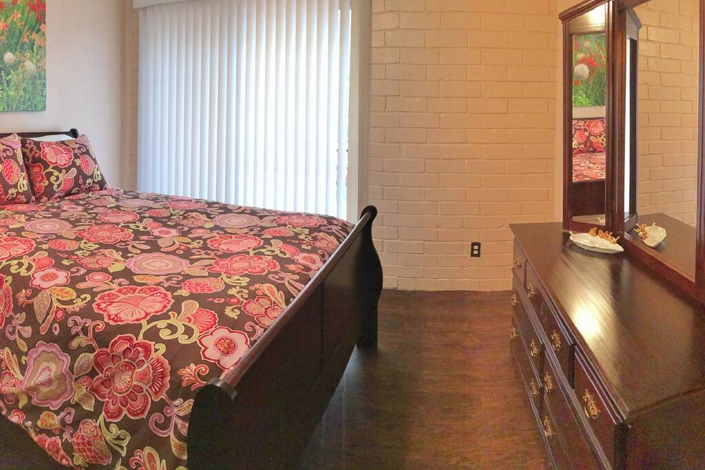 Queen bed in bedroom and deluxe queen air mattress also provided.