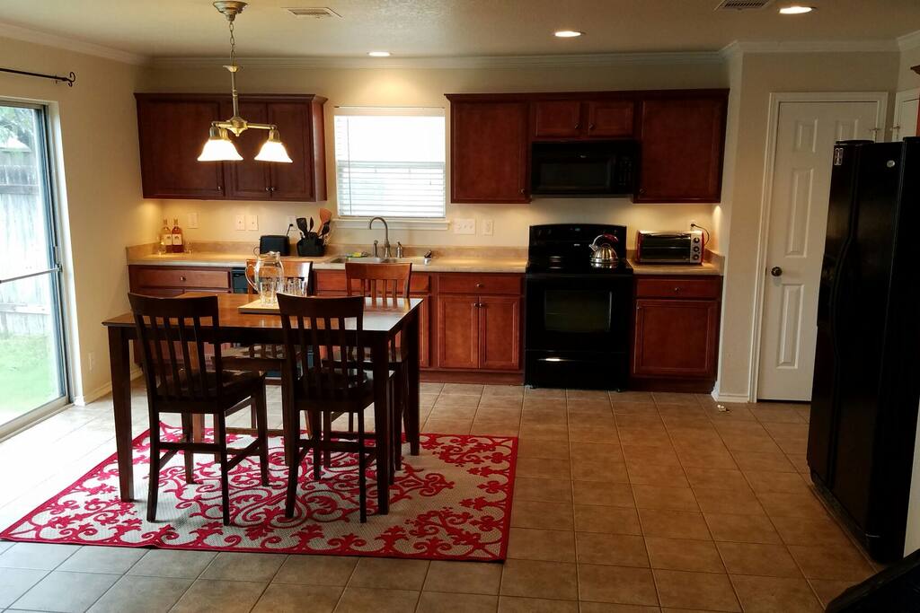 The table can transform into a 6' x 6' and has 8 chairs.