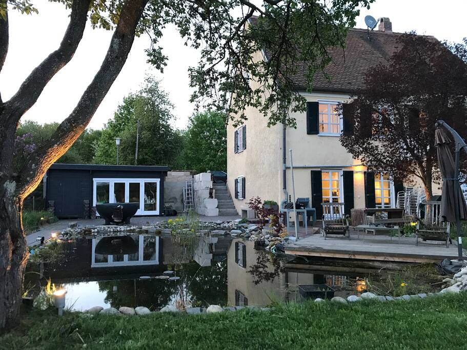 House with pond at dawn