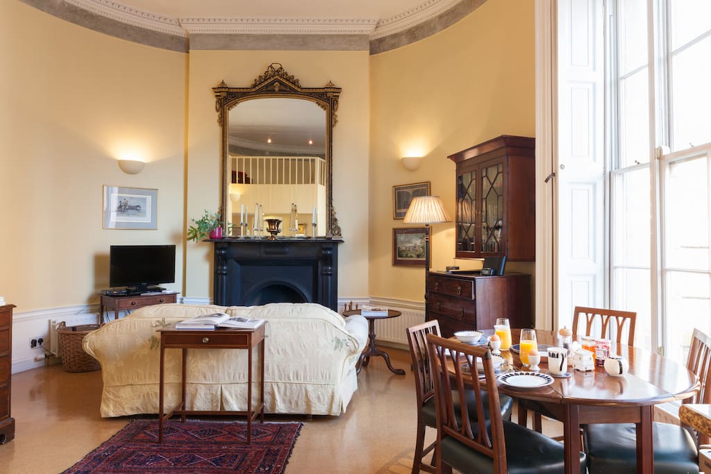 Cosy up in front of the fire within unique curved walls.