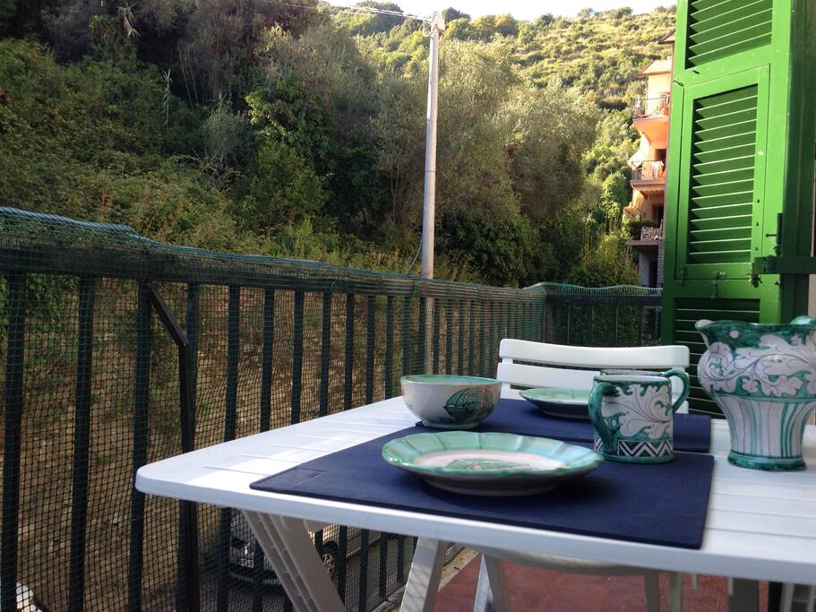The apartment is in a quiet residential area surrounded by hills and olive trees