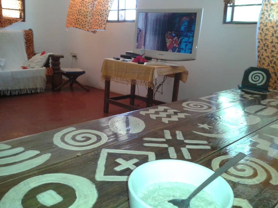 Common area with satellite TV and lots of DVDs to borrow. 30 more photos in listing for Magharibi House downstairs.