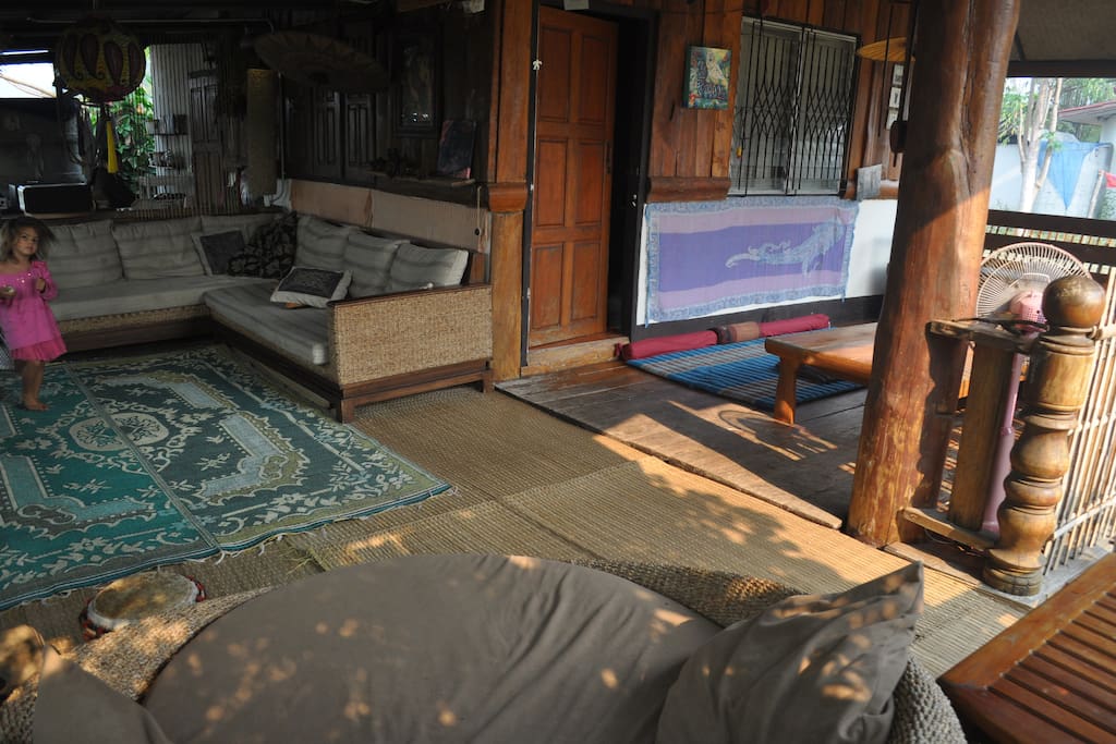 L shaped porch on the side of the house, covered and spacious