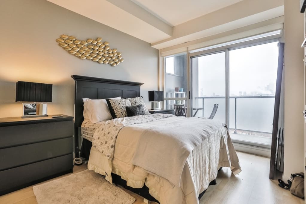 Cozy bedroom with access to balcony.