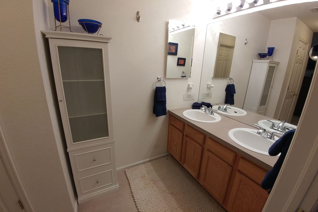 Master Bath double vanity, over sized soaking tub & Aboriginal art details.
