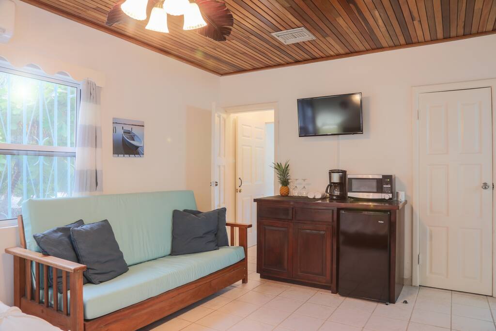 Kitchenette with fridge, coffee maker and microwave
