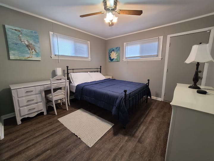 Sleeper 1 has a queen sized bed, large dresser and mirror, a night stand, and a desk and chair if you need to get some work done. An Echo dot device can turn lights on or off, set an alarm, or play some music. This bedroom has an emergency exit door.