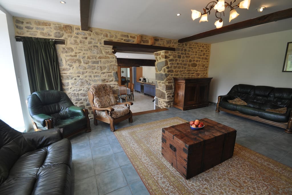 Living Room with plenty of seating with view back to the kitchen