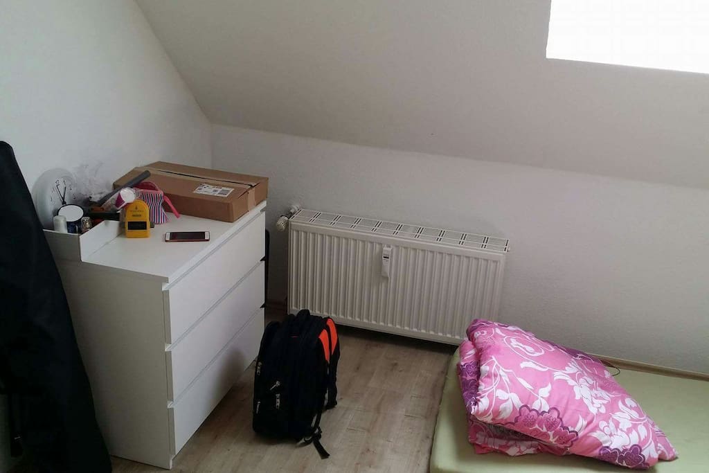 A coner of the sleeping room. The room is about 16m2 and there are single and double mattresses.