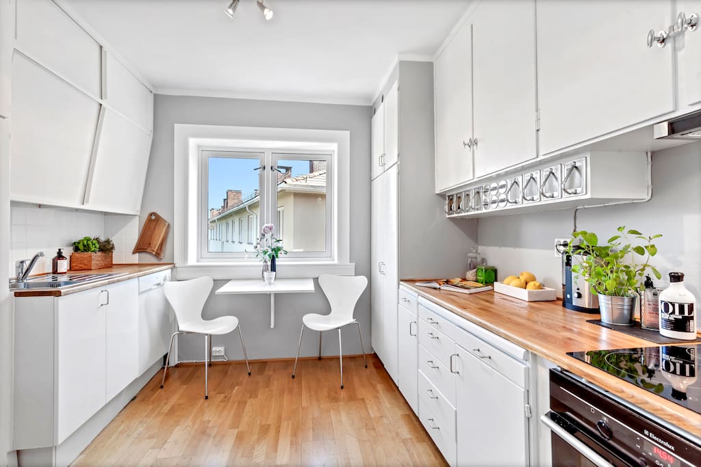 Vintage kitchen well-kept with a new modern stove complete with induction tops.