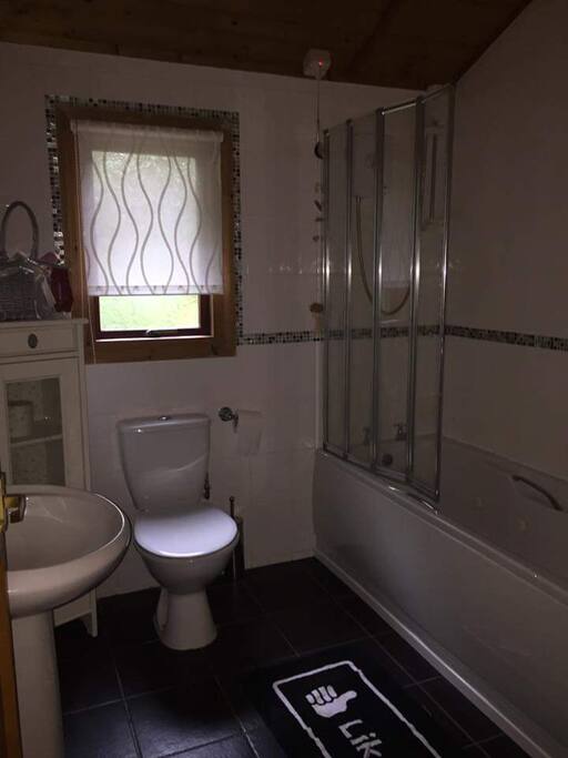 Bathroom with spa bath and shower