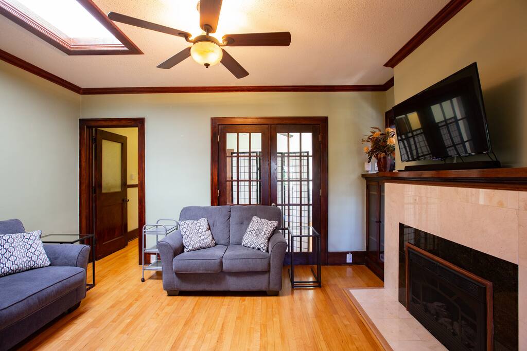 Living room with skylight, fireplace, Roku TV and sound bar