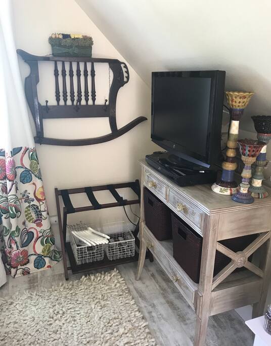 Vintage Rocker coat rack and suitcase area