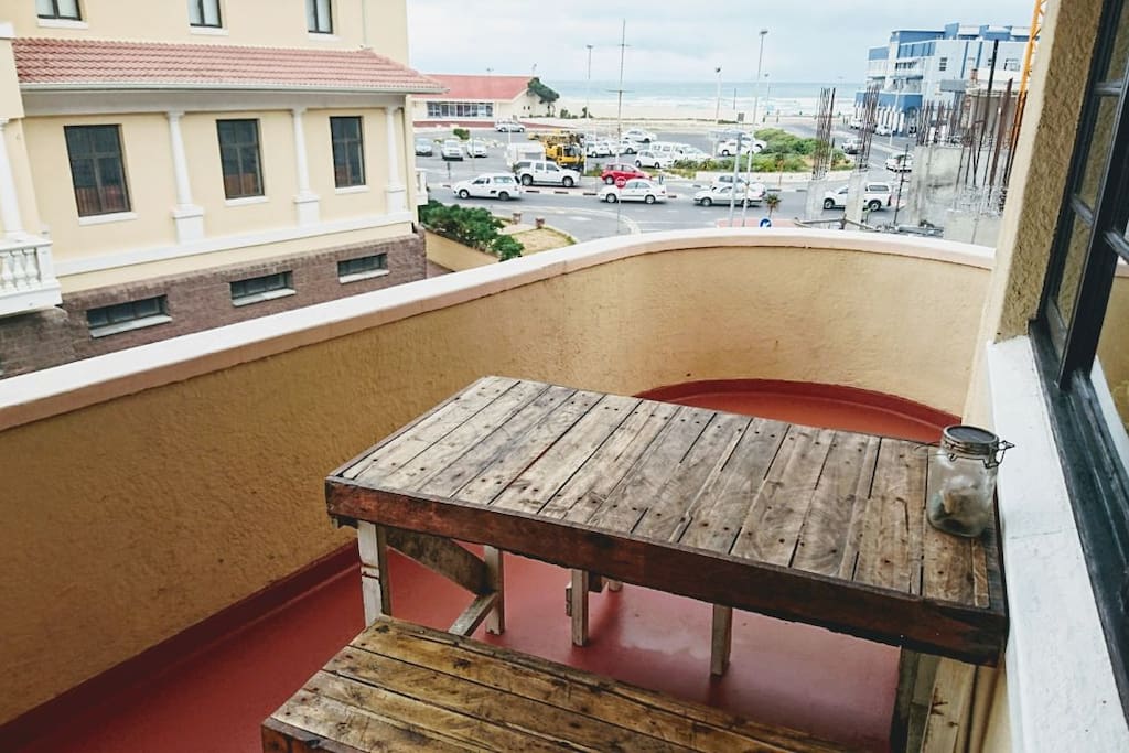 Large outdoor balcony with table and benches - perfect for sun downers or outdoor meals