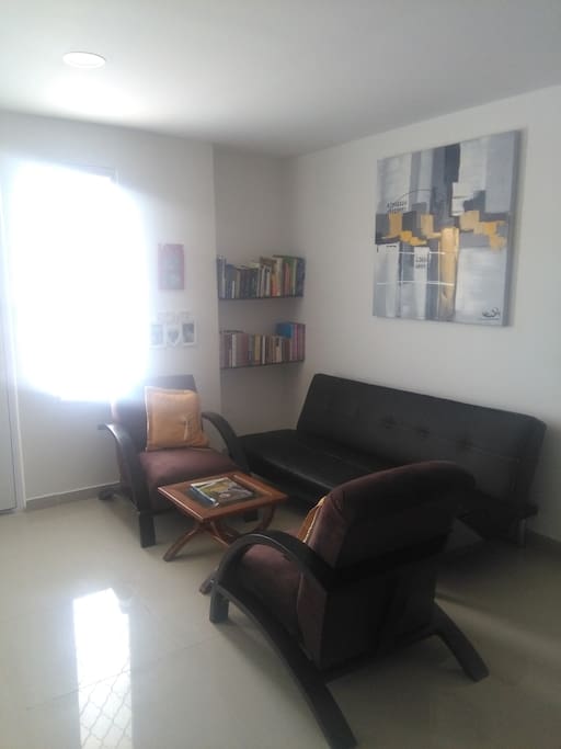 sala de estar con sofacama