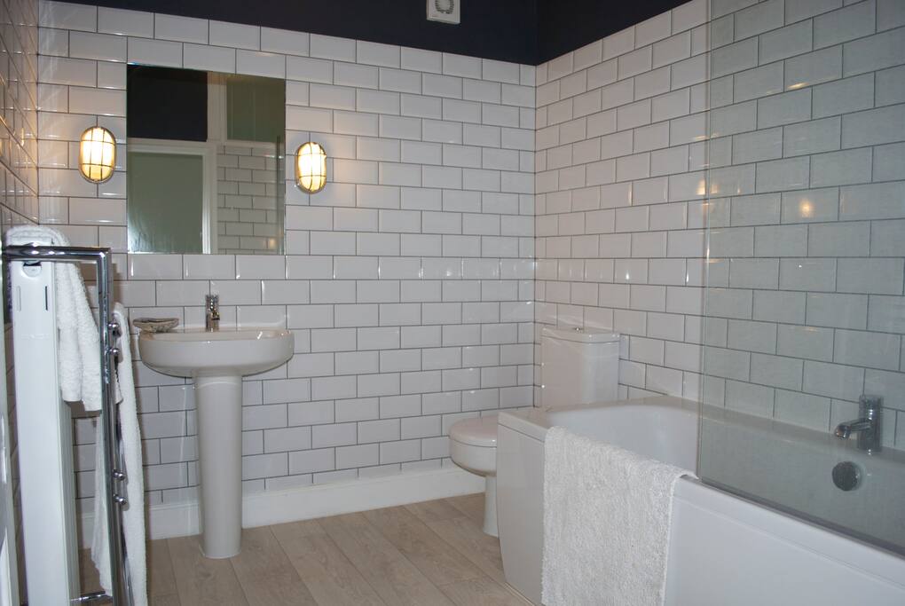 Bathroom has a heated towel rail, double ended bath with a powerful shower.