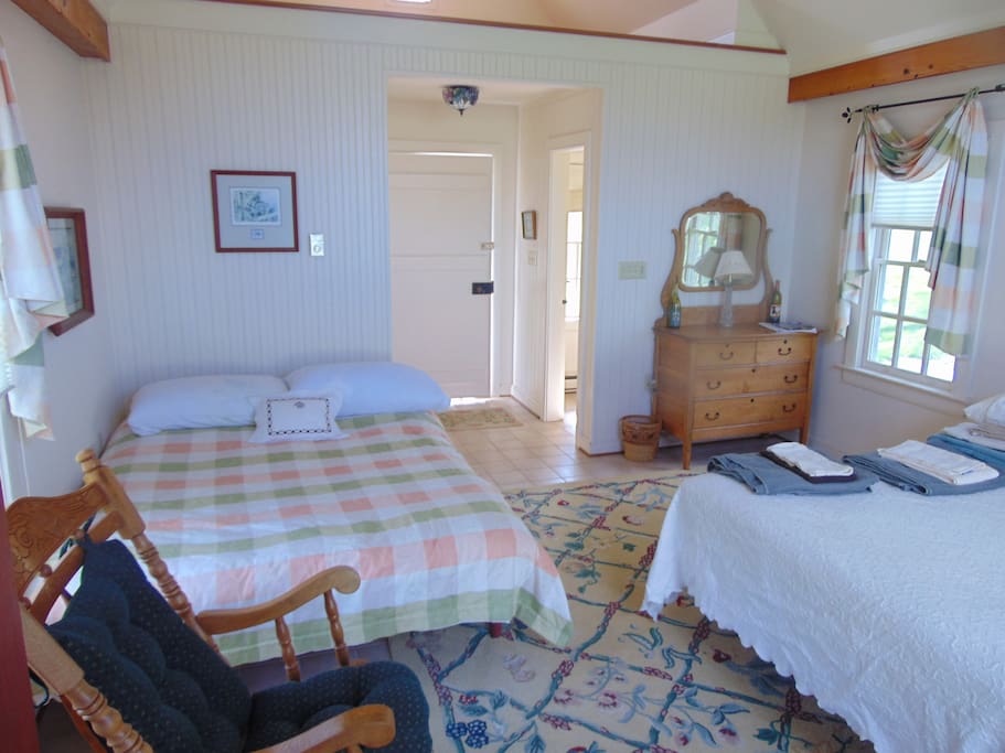 The main room features two double beds.