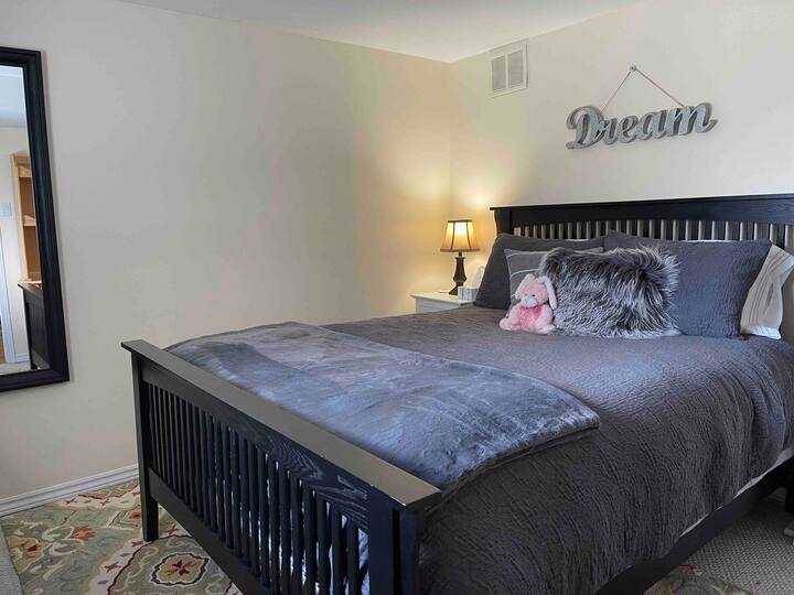 Dream in this comfy Queen Sized bed with a new mattress.   We also offer different pillows with a selection of soft/firm.    Extras here are:  Electric blanket, plush throw.