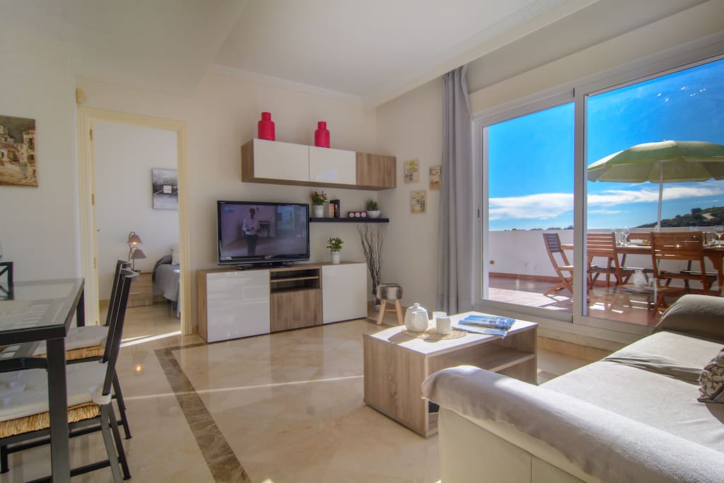 Spacious living room with lounge and dining area