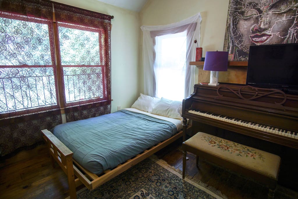 Great Room with natural lighting & piano. Brand new sheets, pillows & pillowcases on futon that sleeps a couple comfortably.