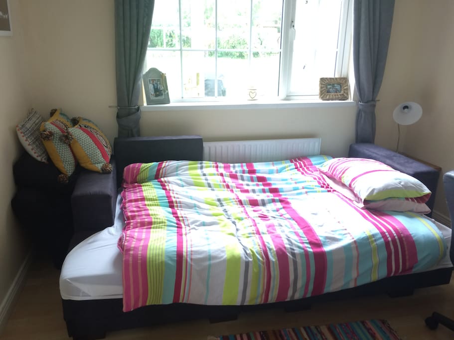 Double sofa bed which easily converts back to a sofa for use during the day. Has storage underneath for the bedding.
